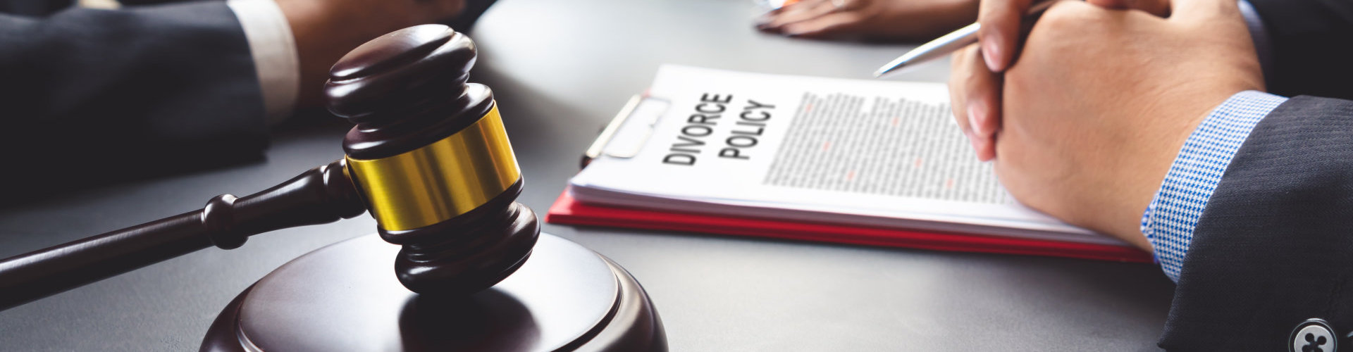 a gavel and documents on the table